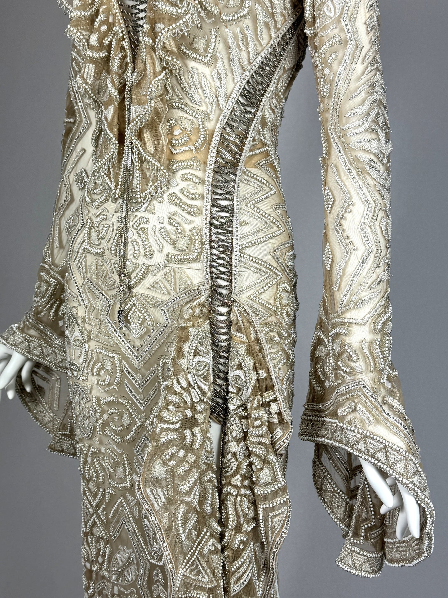 C. 2011 Roberto Cavalli Couture Numbered Plunging Sheer Nude African Tribal Masai Mask Beaded Chain Corset Gown Dress w Bell Sleeves