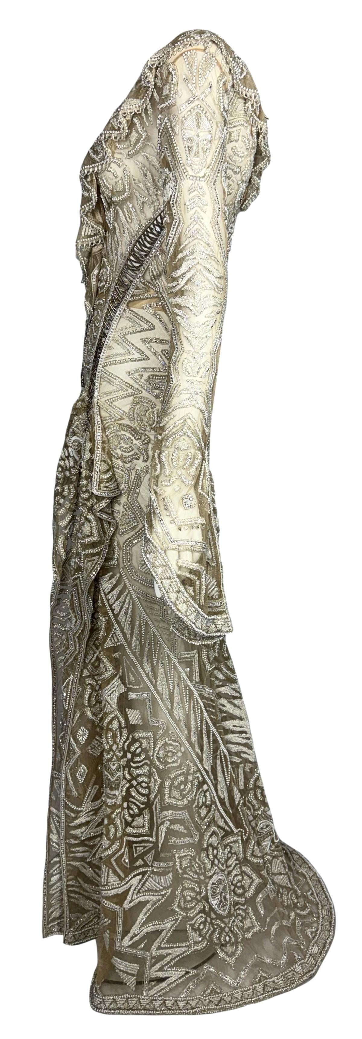 C. 2011 Roberto Cavalli Couture Numbered Plunging Sheer Nude African Tribal Masai Mask Beaded Chain Corset Gown Dress w Bell Sleeves